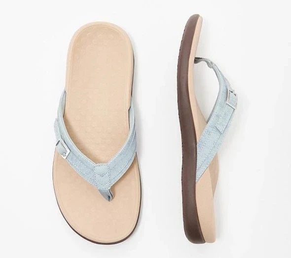 Flat lay of a light blue thong sandal from above and the side, beige footbed 9