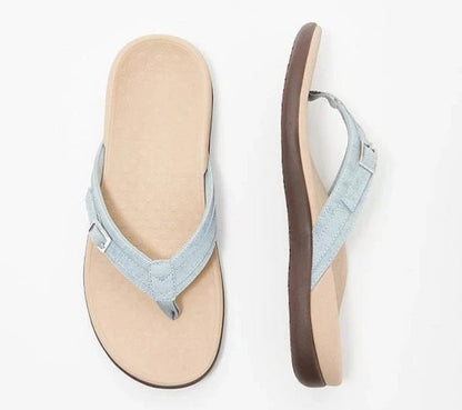 Flat lay of a light blue thong sandal from above and the side, beige footbed 9