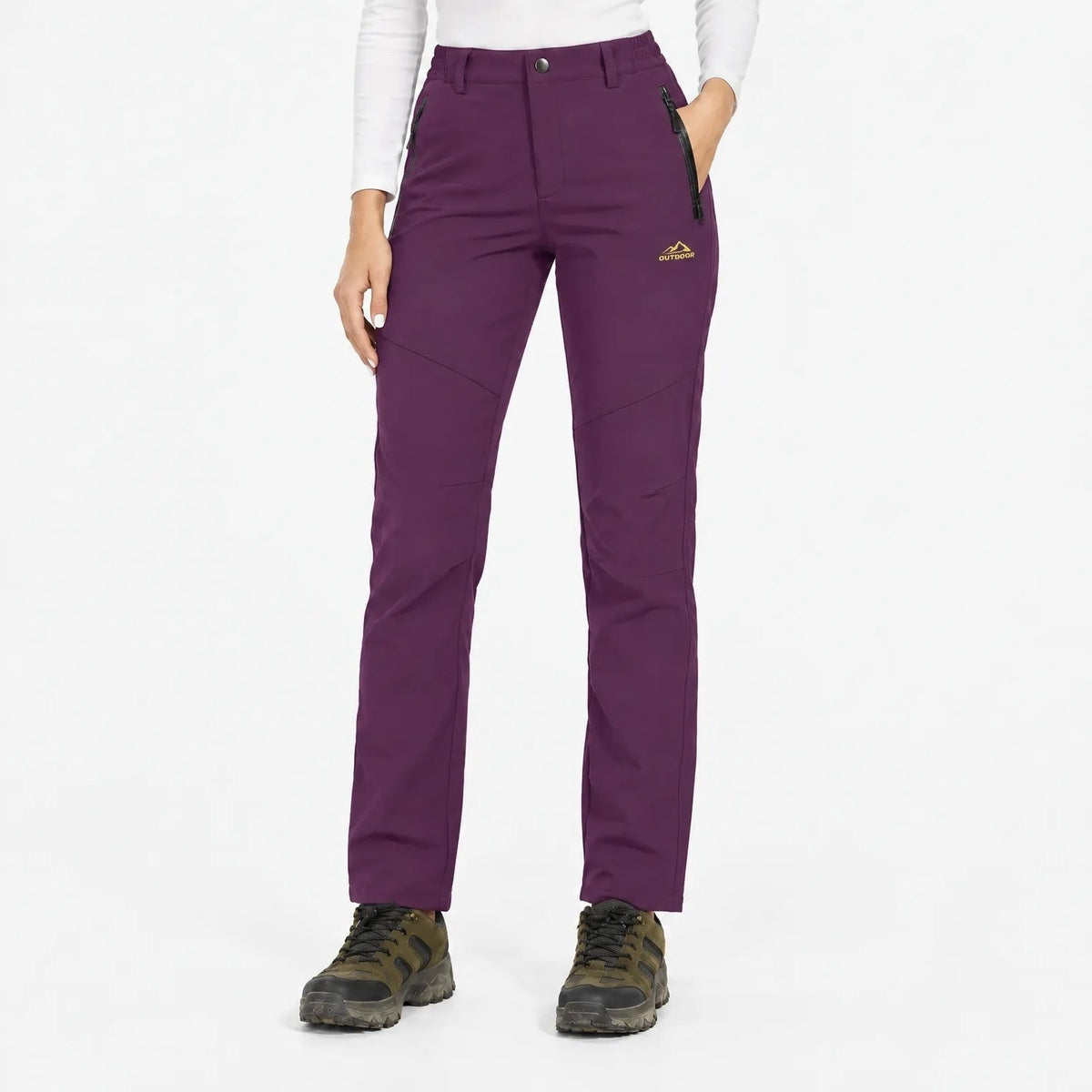 Front view of the trousers in a rich plum purple, with one hand in the pocket 18
