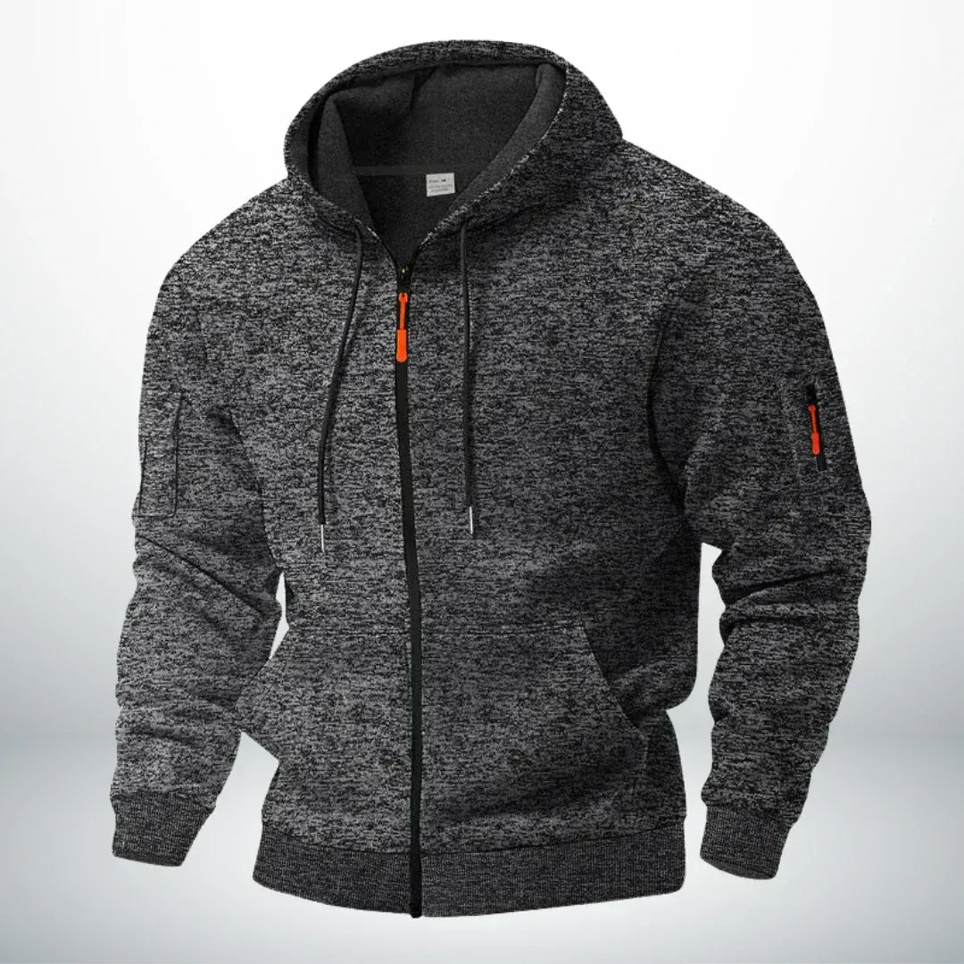 Front view of the hoodie in mottled dark grey, with front pockets and a zipped sleeve pocket 5
