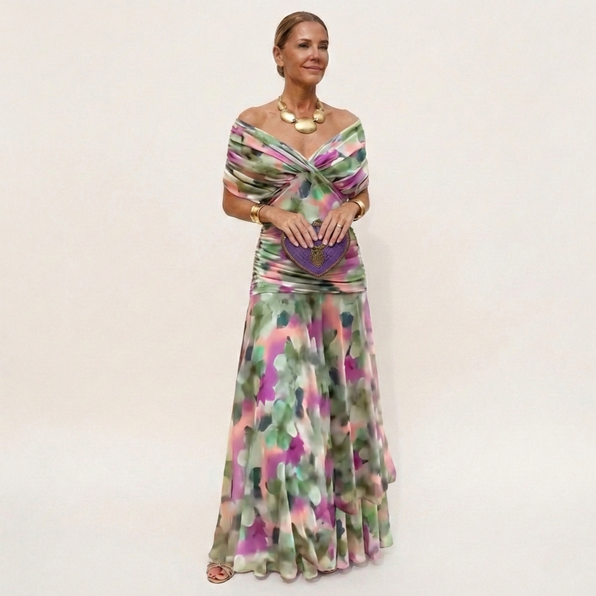 Full-length view of a blurred green, pink and purple floral print version with a gathered off-the-shoulder bodice. 6