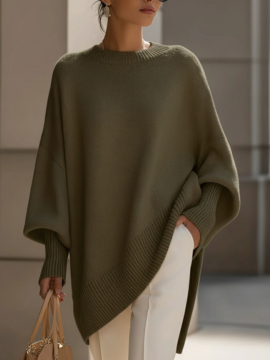 Olive green version of the knit poncho worn by a model, with ribbed cuffs and hem 8