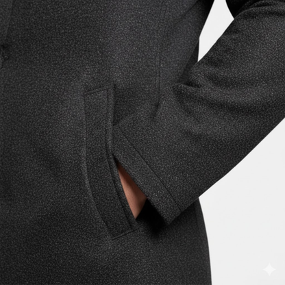 Close-up of a model's hand in the angled side pocket, showing the speckled dark wool texture 8