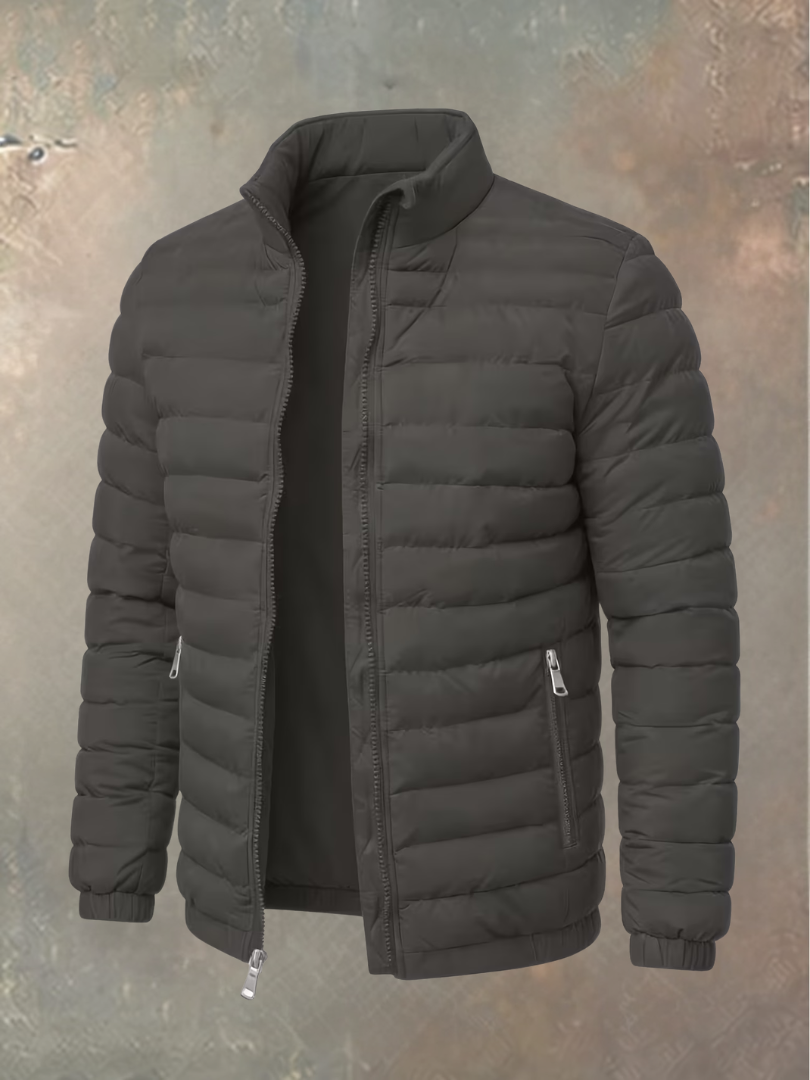 Quilted puffer jacket in dark grey, unzipped, with silver zips on the pockets and front 5
