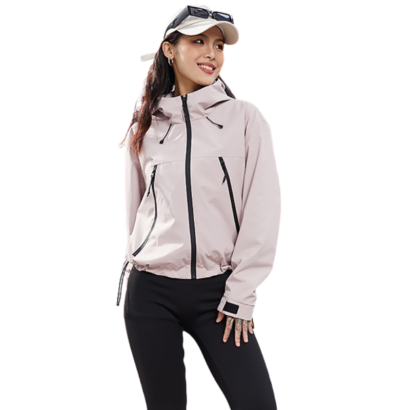 Pale pink jacket with the hem drawcord pulled tight, woman smiling and looking to the side 10