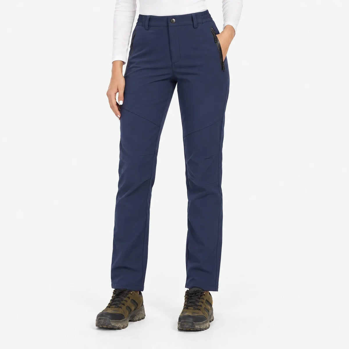 Front view of navy trousers on a model with zipped pockets and an elasticated waistband 3