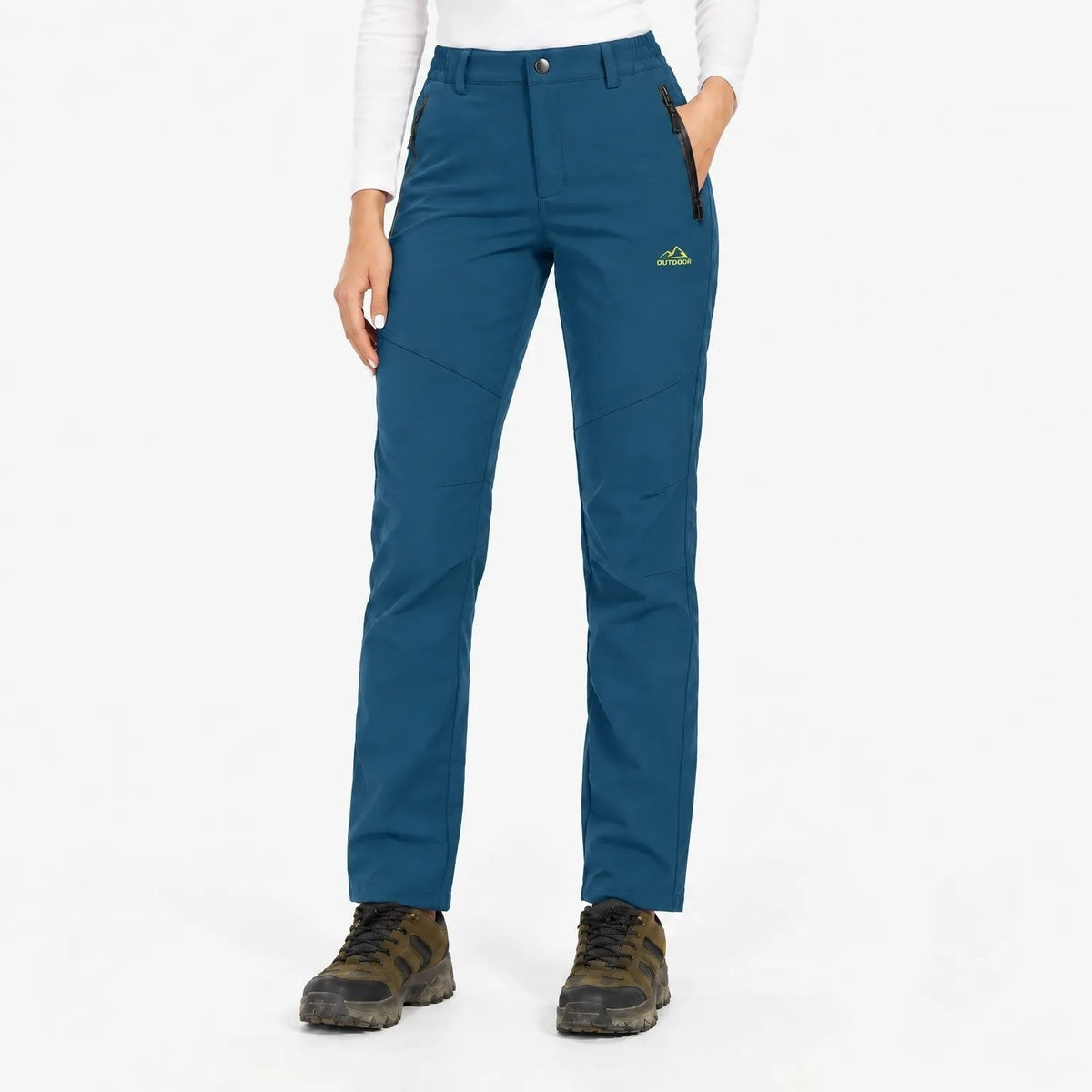 Front view of the trousers in a deep teal blue with black zipped pockets 20