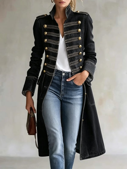 Model wearing the coat in a black version with gold buttons and light braiding, styled with a white top and jeans. 9