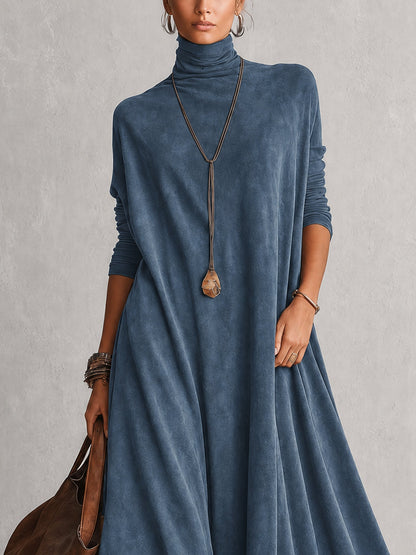 Close-up of the blue dress's roll neck, long sleeves and loose fit above the waist 11