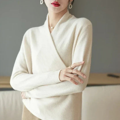 Model in cream wrap jumper with arms crossed, showing the long sleeves and crossover front 6