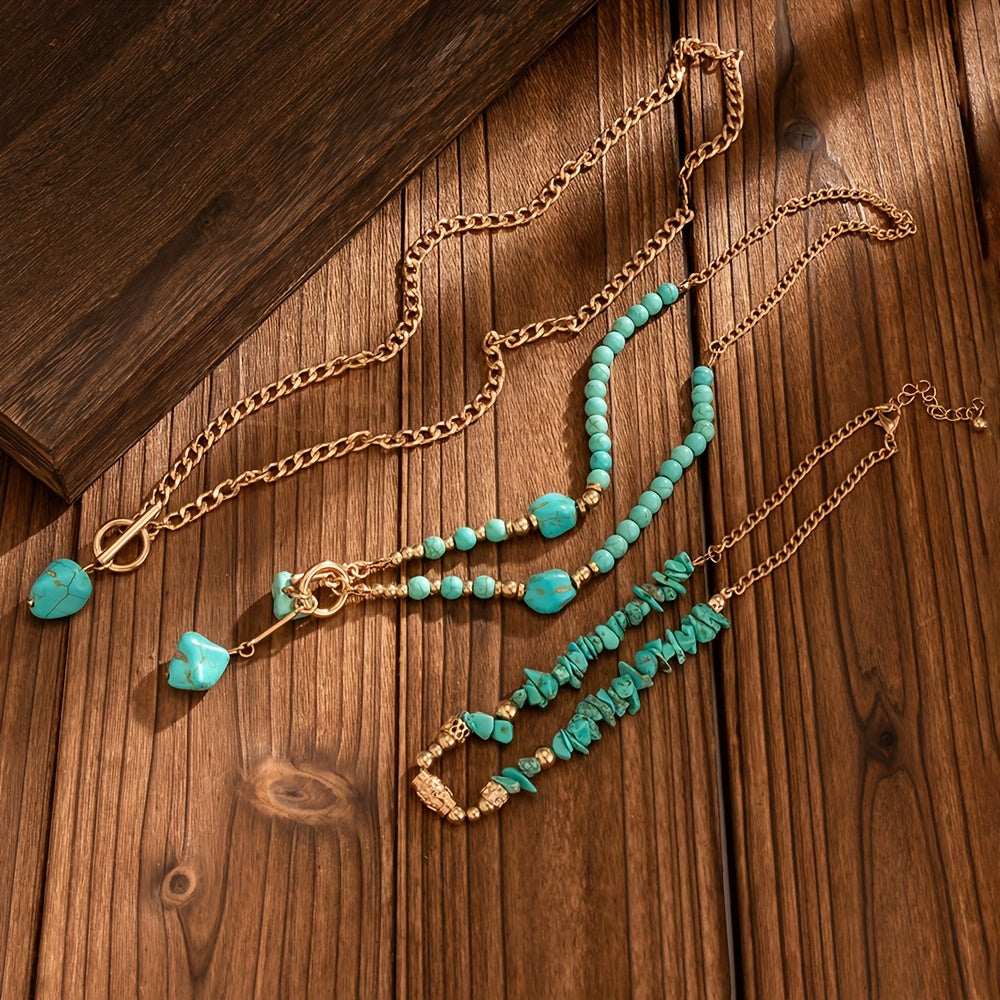 Flat lay of the three separate necklaces untangled on a wooden surface, showing each one's length and clasp 7