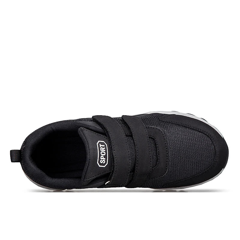 Top-down view of a black shoe showing the two straps, padded collar and opening 16