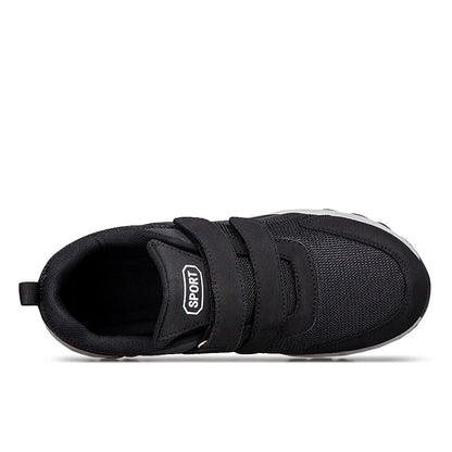 Top-down view of a black shoe showing the two straps, padded collar and opening 16
