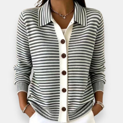 Model wearing the collared cardigan in grey and white stripes, with a white button placket, brown buttons and ribbed cuffs. 3