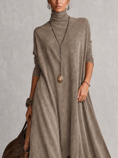 Close-up of the taupe dress's high neck, long sleeves and soft suede-look fabric 13
