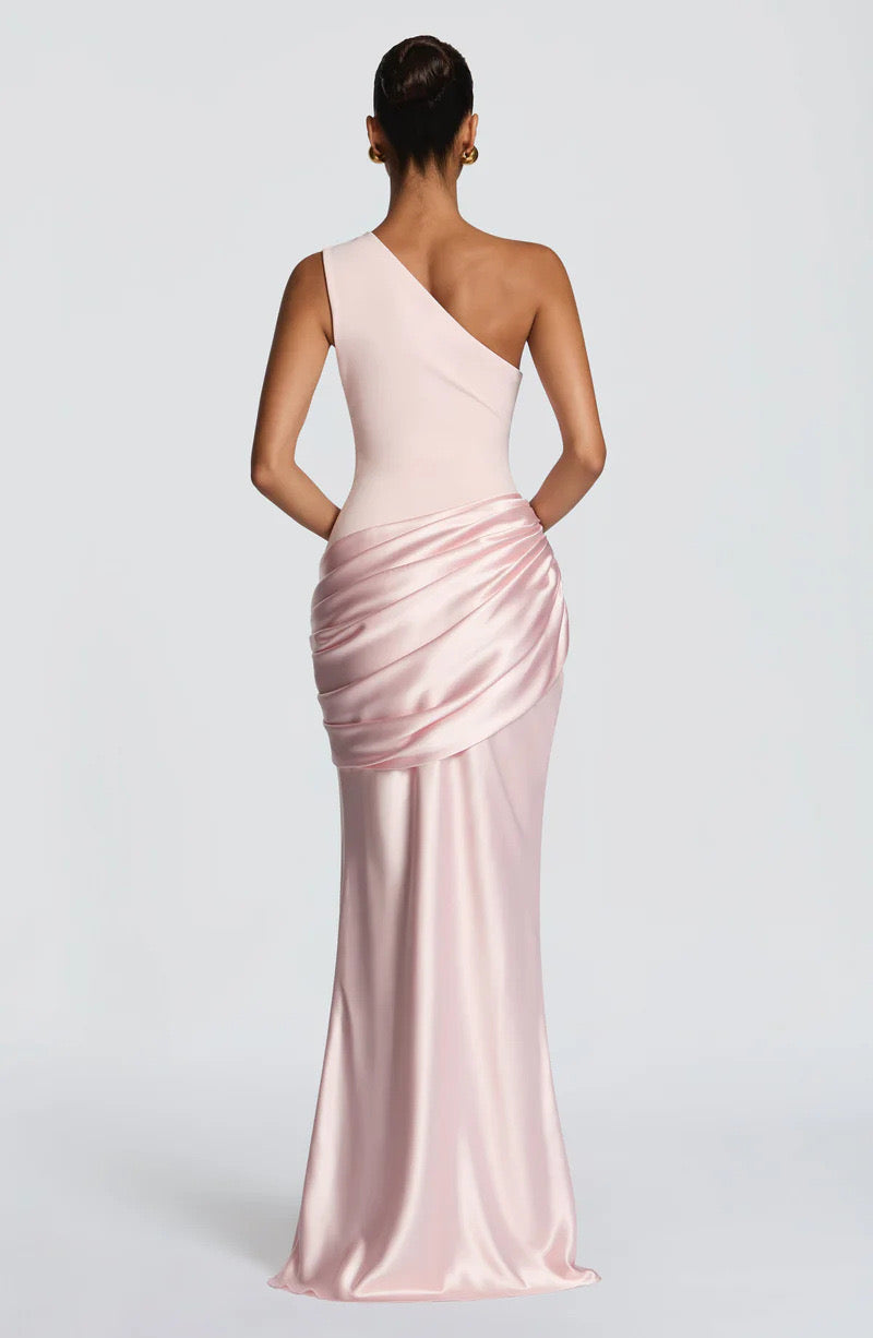 Back view of the blush pink dress, showing the sloped back neckline and draped satin across the hips. 20