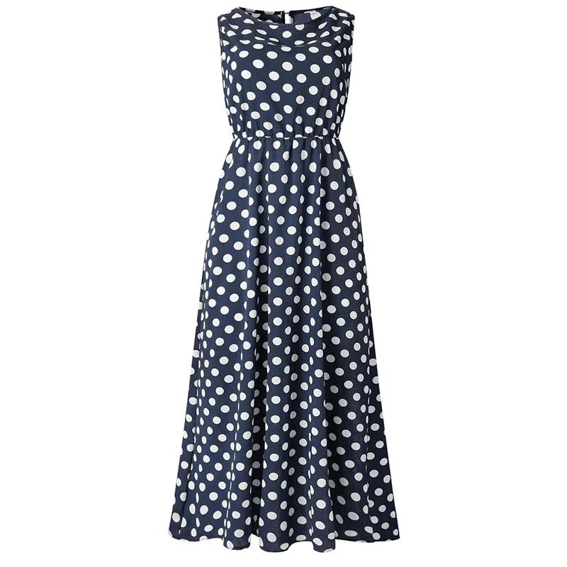 Navy blue dress with white polka dots shown flat from the front, with elasticated waist 6