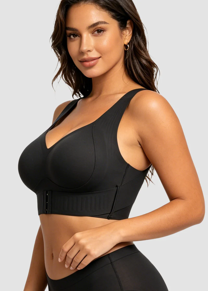Three-quarter front view of the black bra on a model, showing the front hook closure and wide straps 14