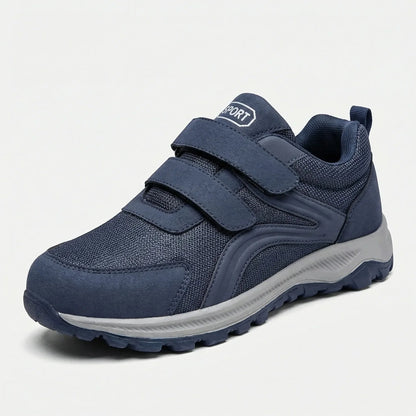 Single navy strap shoe with mesh upper and grey sole, front three-quarter view on white 11