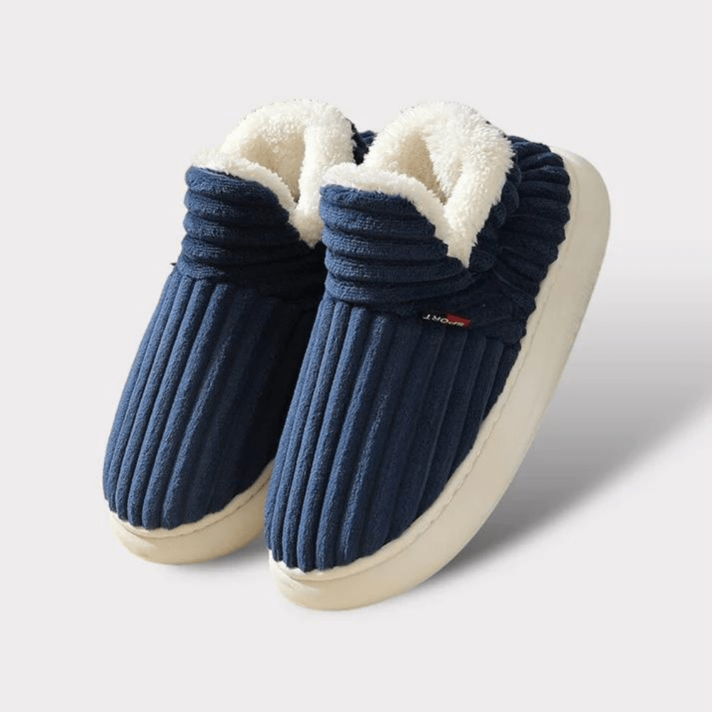 Pair of blue ribbed slippers with white lining on a light gray background