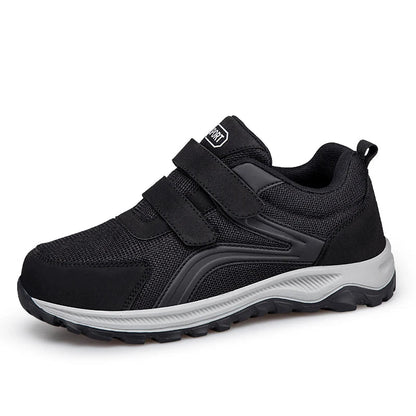 Single black strap shoe with grey sole, angled front view on a white background 15