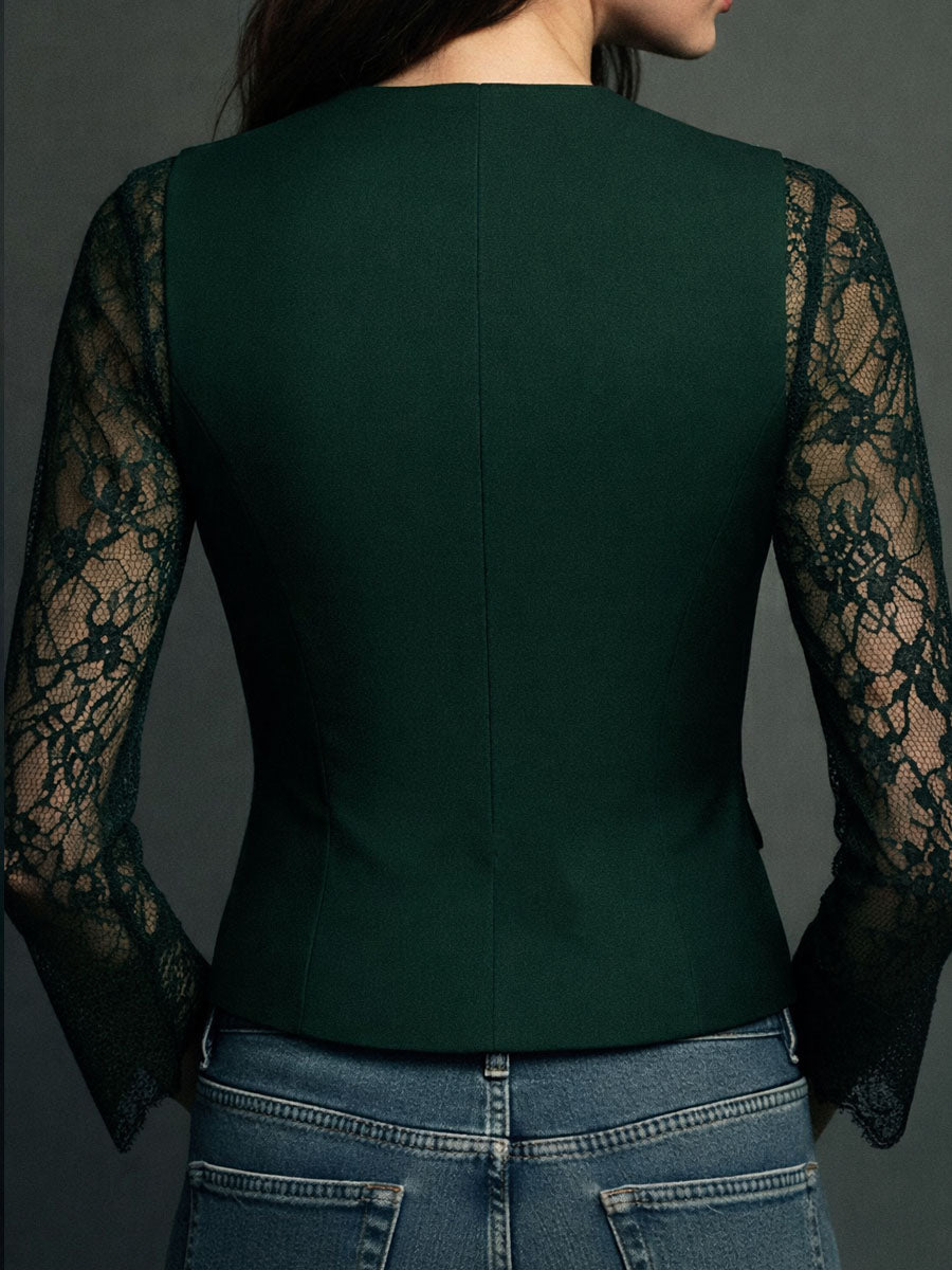 Back view of the dark green version, showing a seamed fitted back and sheer green lace sleeves 15
