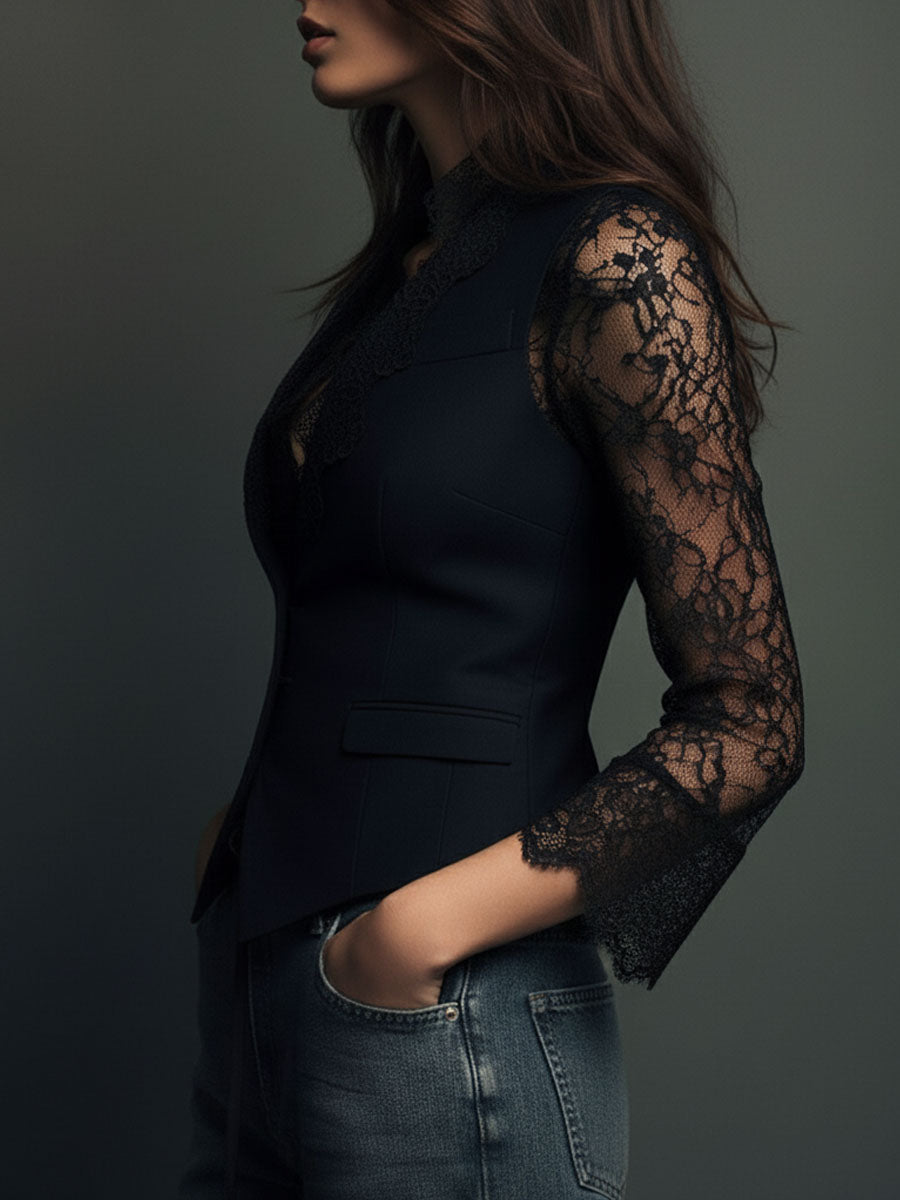 Close side profile of the black jacket, showing the sheer lace sleeve, lace cuff and fitted waist 11