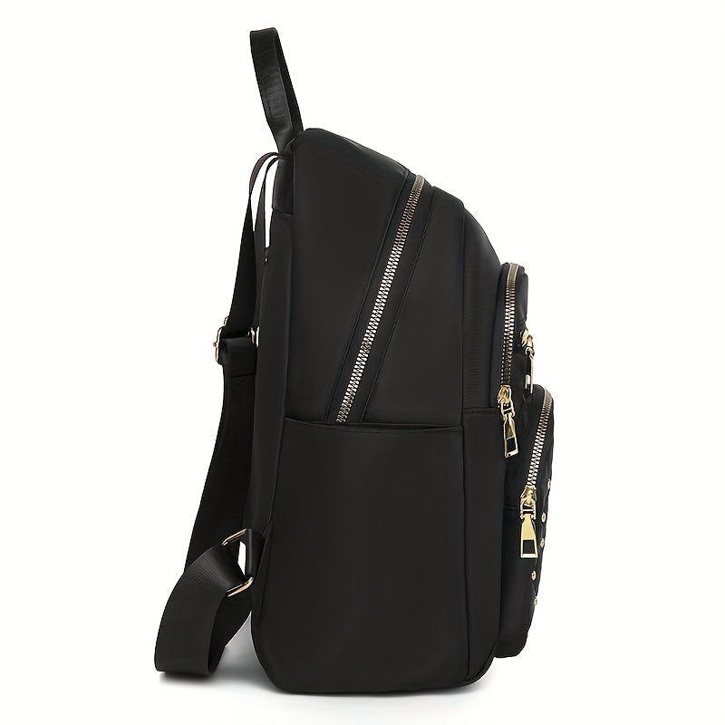 Side view of the black backpack showing the slim profile, side pocket, diagonal zip and strap 6