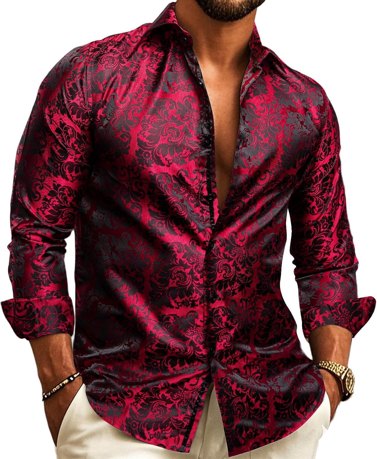 Close, larger view of a model in the shirt with red and black baroque damask jacquard, sleeves cuffed, open collar. 6