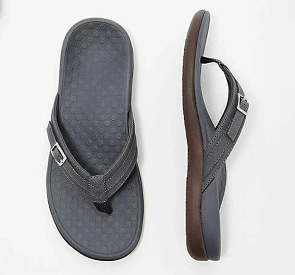 Flat lay of a grey thong sandal from above and the side, dotted footbed 10