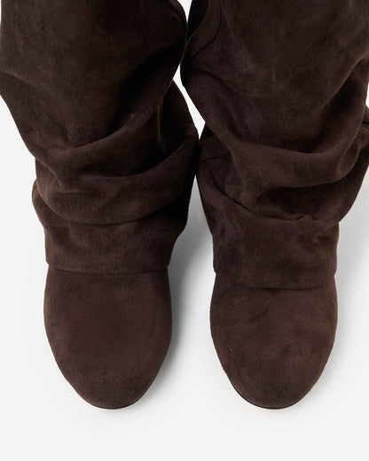 Top-down view of both boots from above, showing the rounded toes and soft folds of the slouchy shaft. 5