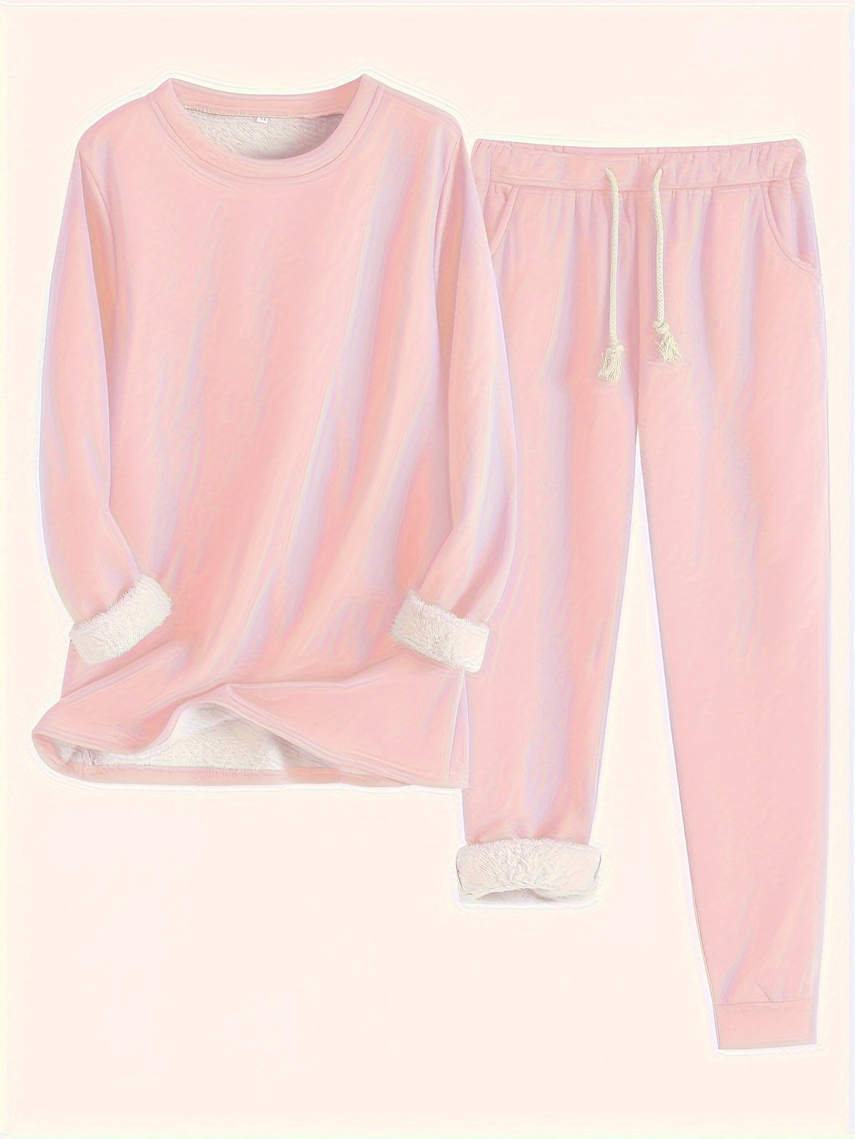 Flat lay of the set in soft pink, showing fluffy white lining at sleeves and ankles 5