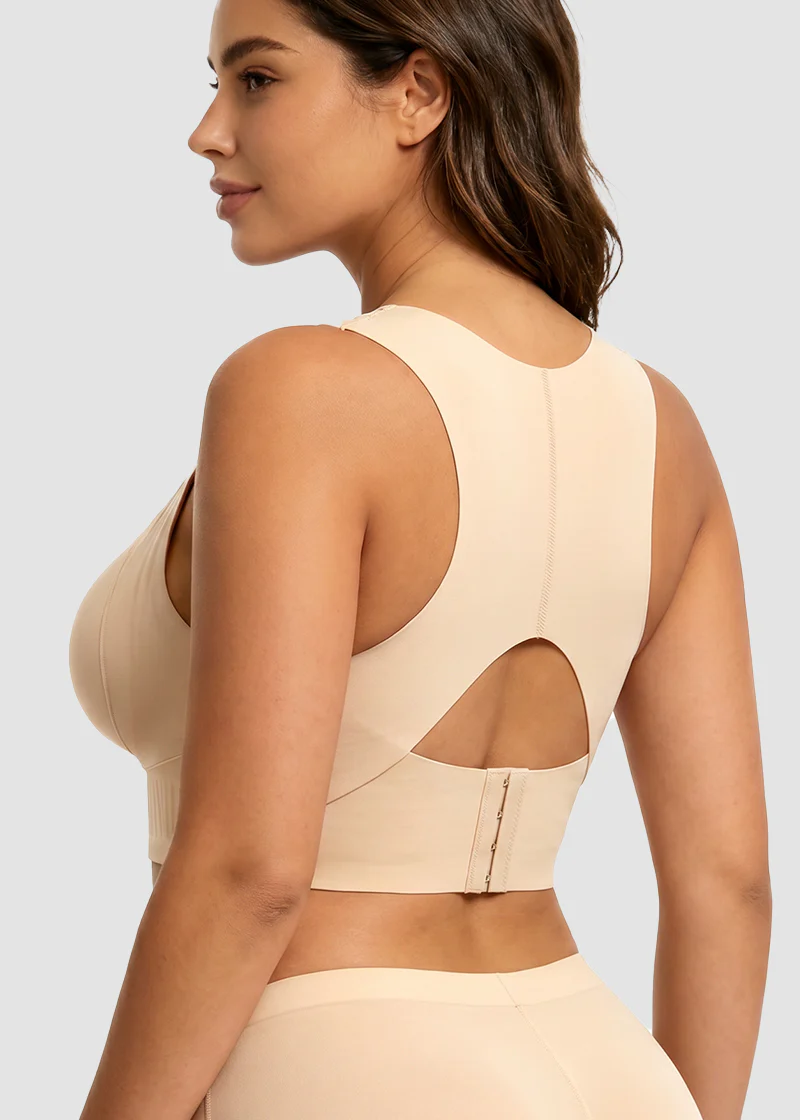 Back view of the beige bra on a model, showing the racerback with keyhole cut-out and hook fastening 3