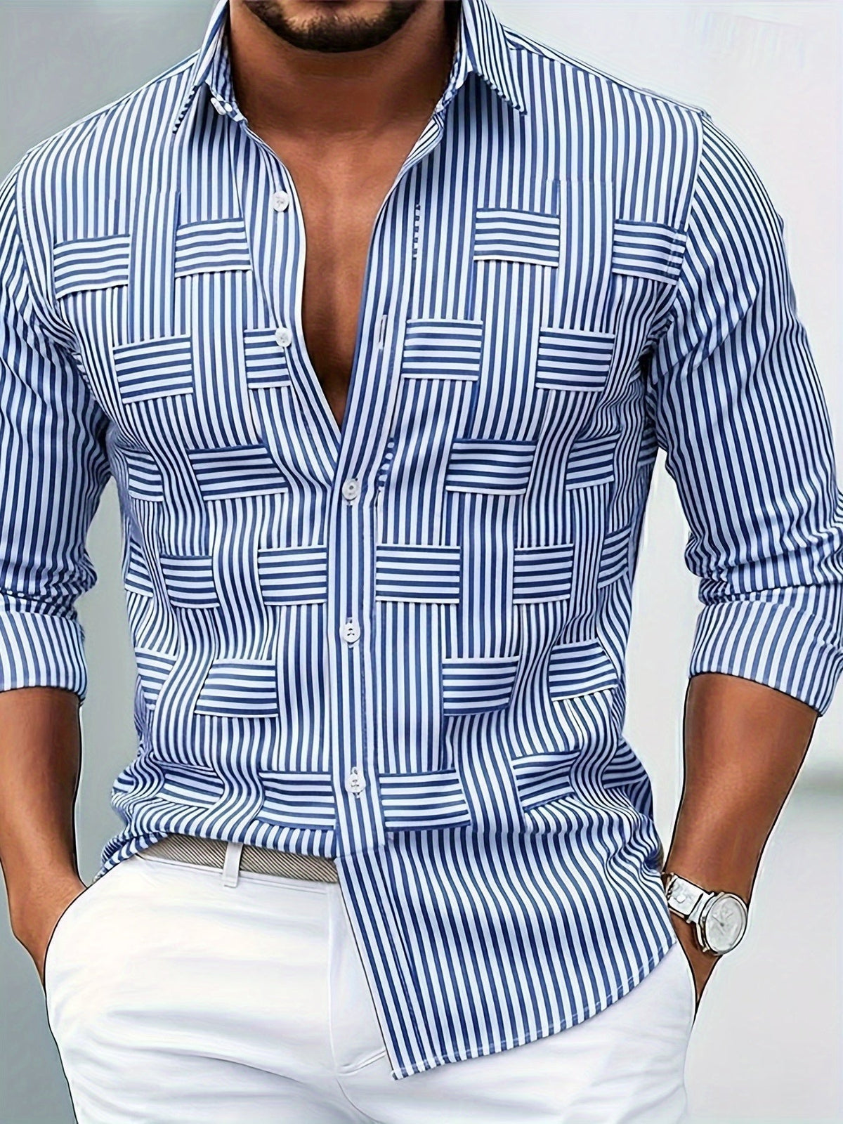 Close-up of a model wearing the blue and white striped shirt, partly unbuttoned, with woven-look panels on the front, white trousers and a watch. 1