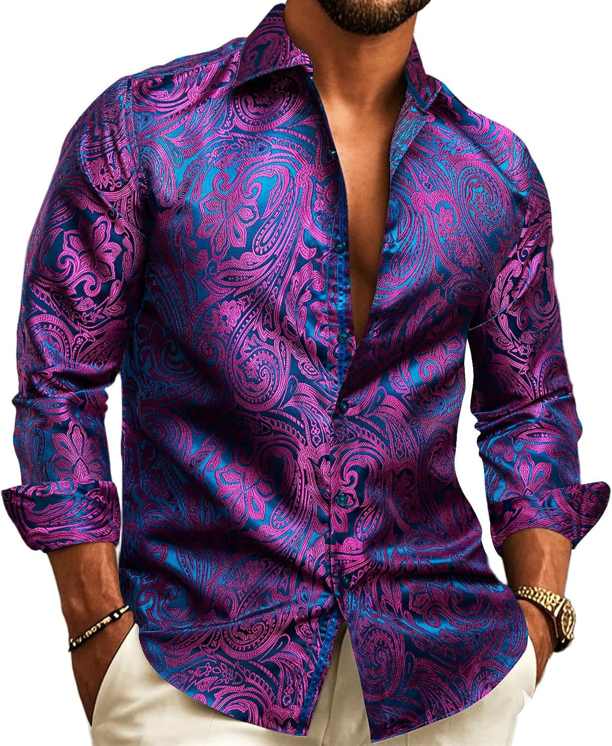 Model wearing the long-sleeve shirt with vivid magenta paisley patterns on a bright blue jacquard base. 14