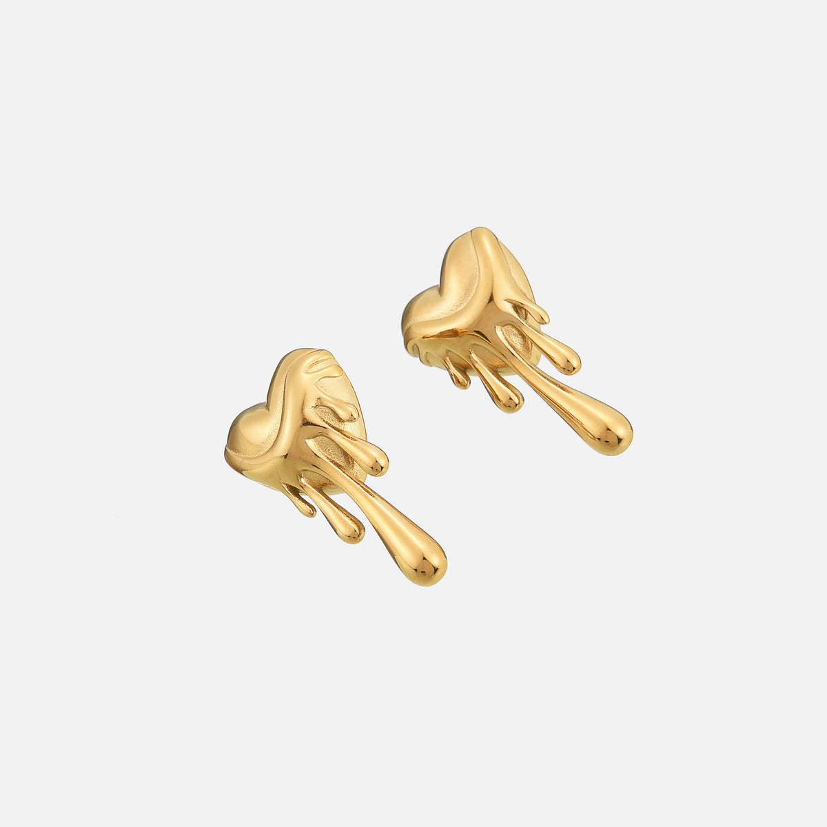 Gold-tone dripping heart earrings photographed at an angle, showing their rounded shape and glossy drips 2