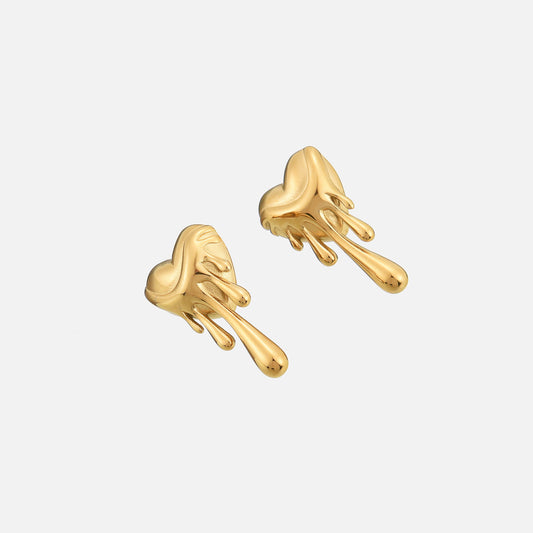 Gold-tone dripping heart earrings photographed at an angle, showing their rounded shape and glossy drips 2
