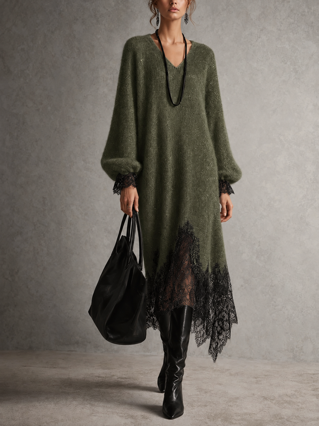 Model wearing the dress in olive green with black lace hem and cuffs, boots and tote 10