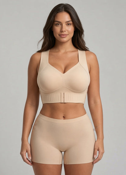 Model facing the camera in the beige bra with matching seamless shorts against a grey backdrop 1