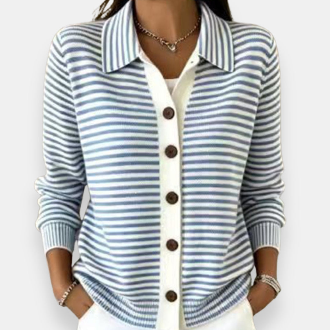Model wearing the collared cardigan in blue and white stripes, with a white button placket, brown buttons and ribbed cuffs. 5