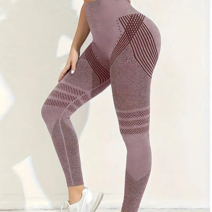 Side view of dusty mauve seamless leggings with dark striped and mesh panels, worn by a model against a white wall. 22