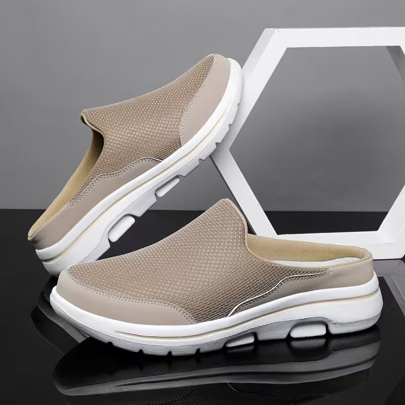 Pair of beige mesh slip-on mules with white soles, one leaning on a white hexagon frame on a glossy black surface. 4