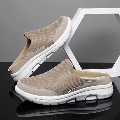 Pair of beige mesh slip-on mules with white soles, one leaning on a white hexagon frame on a glossy black surface. 4