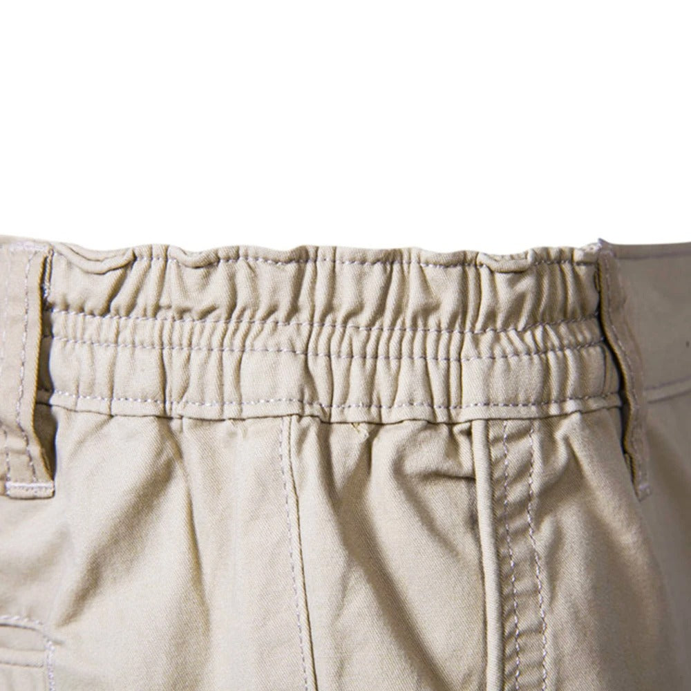 Close-up of the gathered elastic waistband at the back of the beige shorts 4