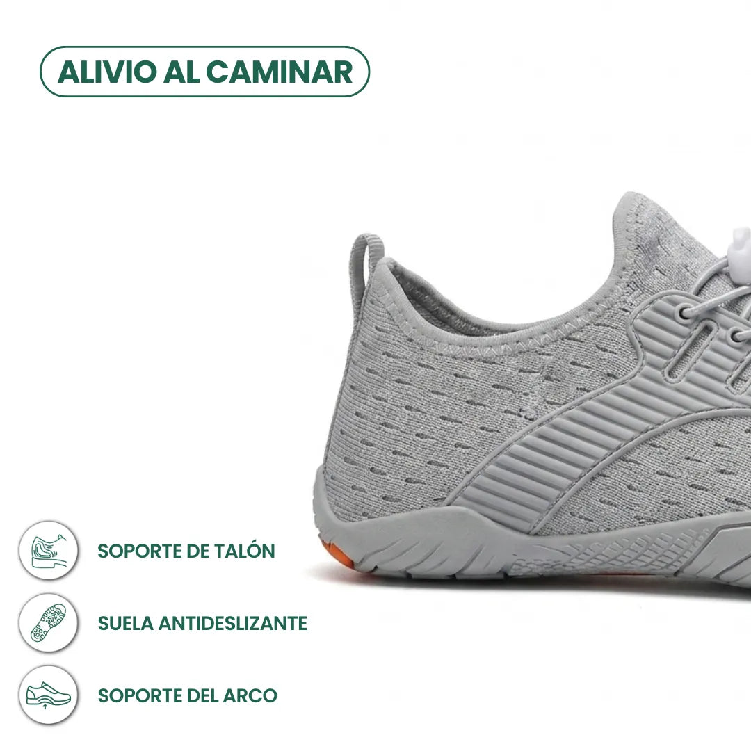 Close-up of the heel of a grey trainer with icons highlighting heel support, non-slip sole and arch support. 13