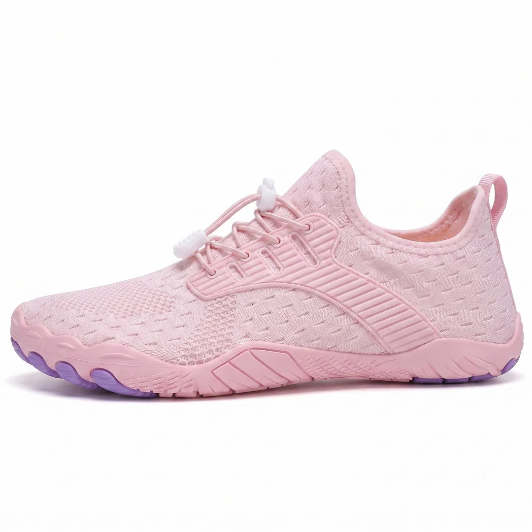 Side view of a pink knit trainer with white toggle laces, ribbed overlay and a purple-tipped flexible sole. 28