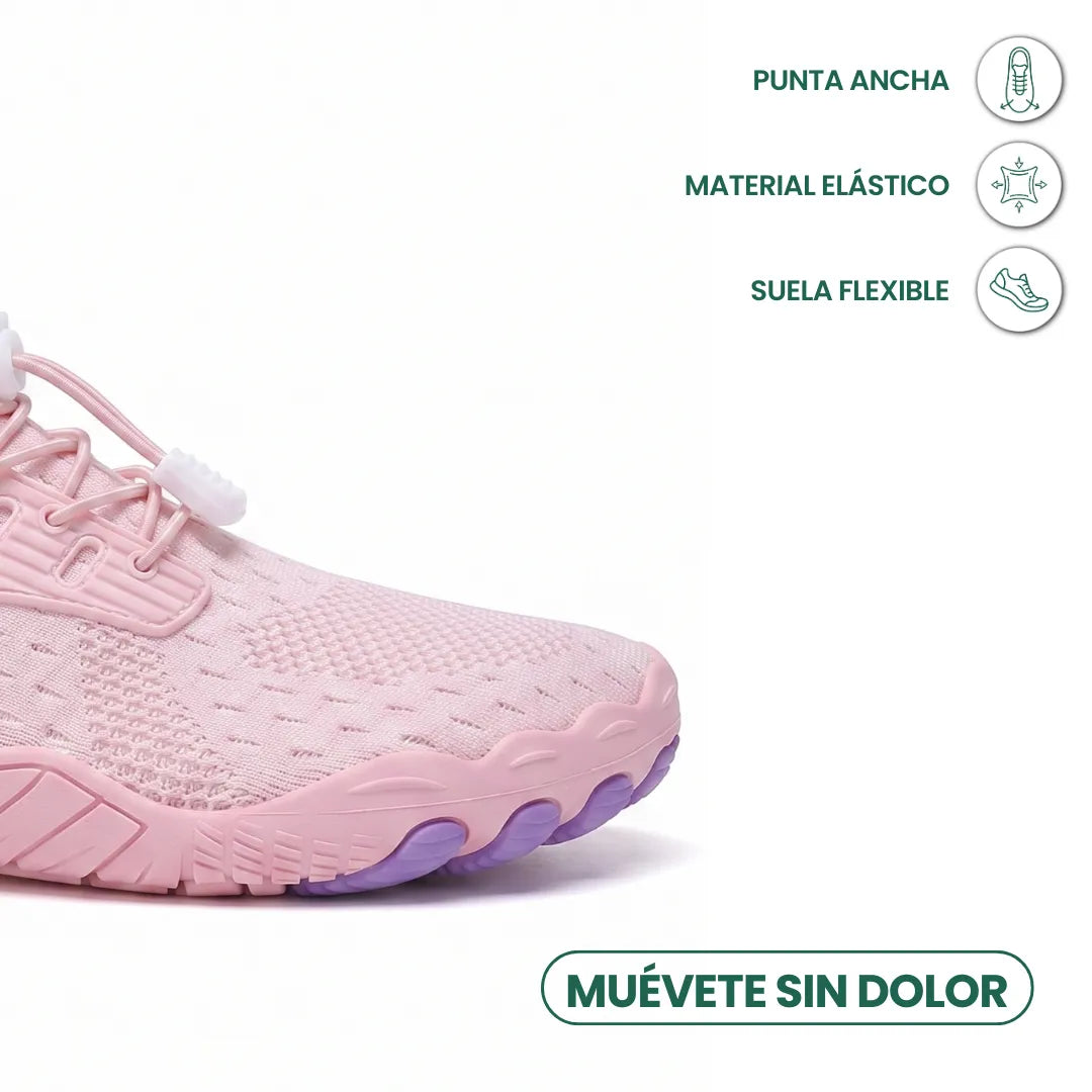Toe-end close-up of a pink knit trainer showing the wide rounded toe, elastic toggle laces and purple flexible sole. 32