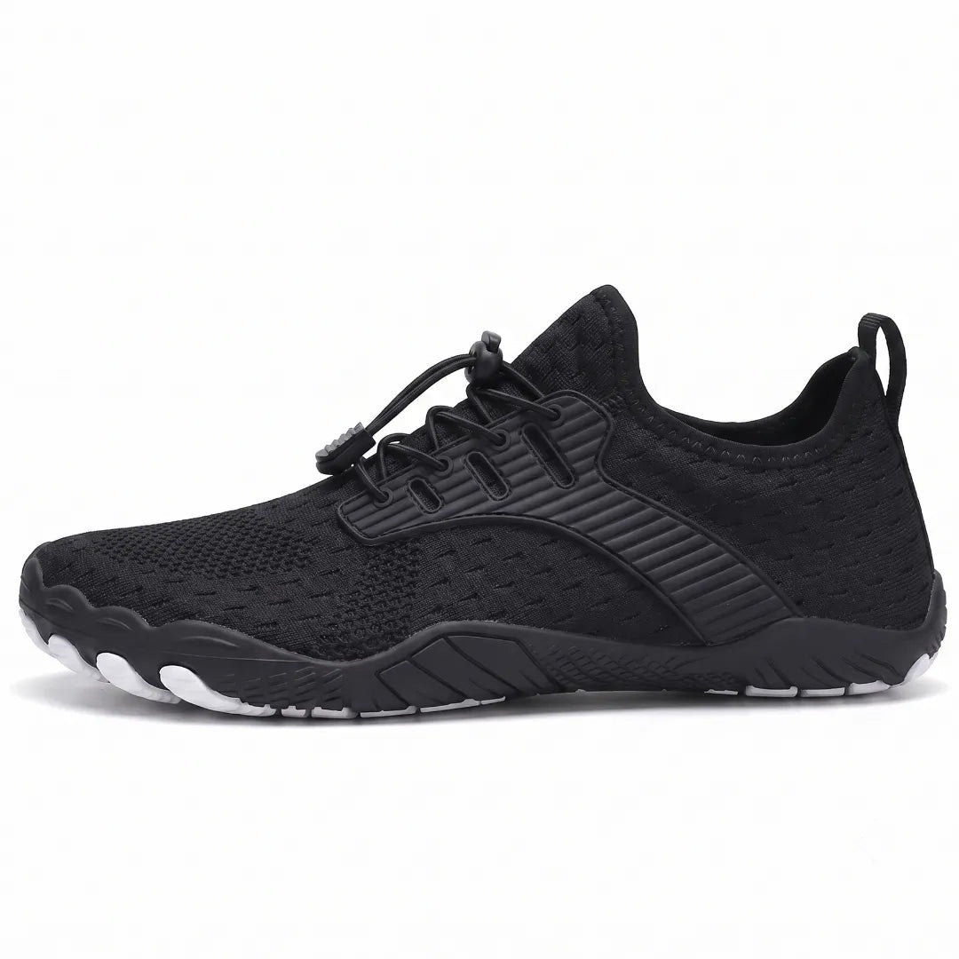 Side view of a black knit trainer with elastic toggle laces, ribbed overlay and a flexible sole with white toe tips. 37