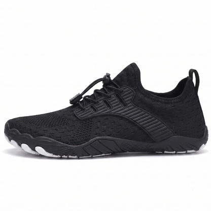 Side view of a black knit trainer with elastic toggle laces, ribbed overlay and a flexible sole with white toe tips. 37