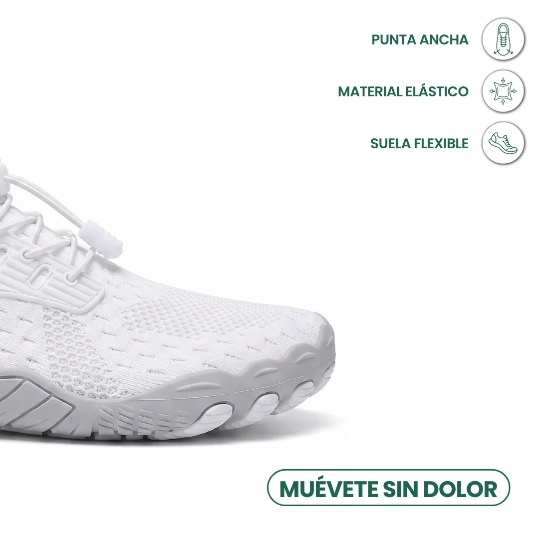 Close-up of the wide toe area of a white trainer with icons for roomy toe, stretchy material and flexible sole. 5